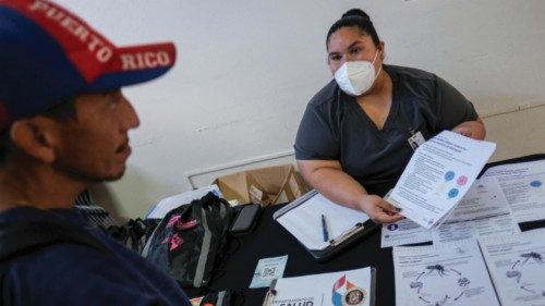 A registered nurse, Monica Soto gives information to Francisco Sierra during a health fair, after a ... A registered nurse, Monica Soto gives information to Francisco Sierra during a health fair, after a ...