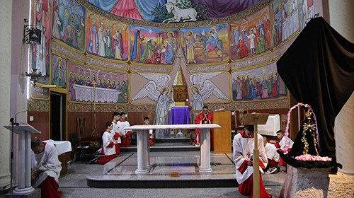 Altar boys take part in a Good Friday mass at the Holy Family church in the Al-Zaytoun neighbourhood ...