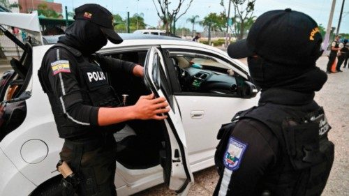 A police officer checks a vehicle during a security operation in Guayaquil, Ecuador, on April 1, ... A police officer checks a vehicle during a security operation in Guayaquil, Ecuador, on April 1, ...