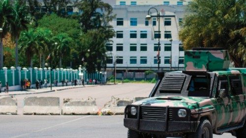 A police vehicle monitors the area near the National Palace and Ministry of Finance building in ... A police vehicle monitors the area near the National Palace and Ministry of Finance building in ...