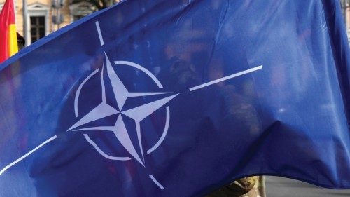 NATO enhanced Forward Presence Battle Group Canadian serviceman holds NATO flag as Latvia celebrates ... NATO enhanced Forward Presence Battle Group Canadian serviceman holds NATO flag as Latvia celebrates ...