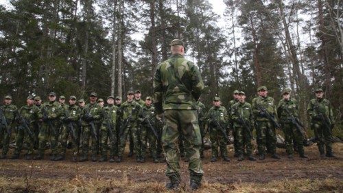 A group of conscripts from the Gotland regiment listen to instructions as they train outside Visby ... A group of conscripts from the Gotland regiment listen to instructions as they train outside Visby ...