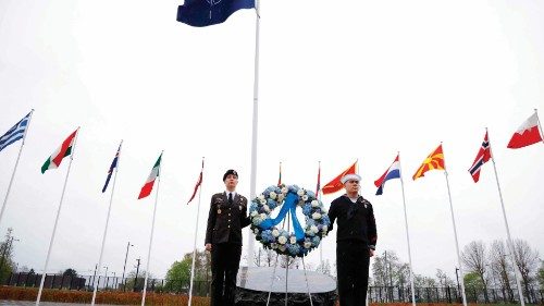 Members of the NATO armed forces wait for the start of the wreath laying ceremony marking the North ... Members of the NATO armed forces wait for the start of the wreath laying ceremony marking the North ...
