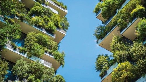 Milan, Italy, High-rise house with trees, shrubs and hedges in the city of Milan.