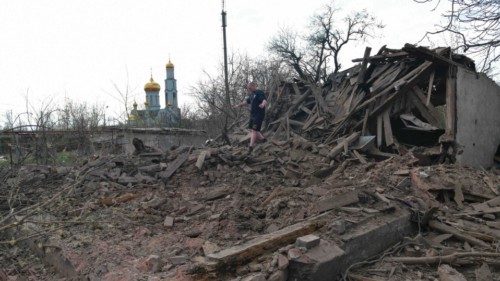A man walks among rubble of a destroyed house hit by recent shelling, what local officials called a ...