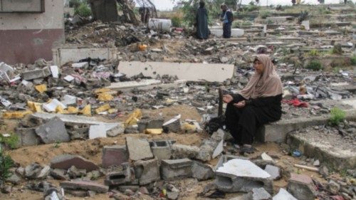 Palestinians visit the graves of people who were killed in the ongoing conflict between Israel and ... Palestinians visit the graves of people who were killed in the ongoing conflict between Israel and ...