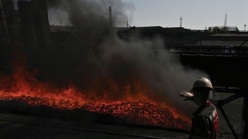 An employee controls coke production at Zaporizhzhia Coke Plant, amid Russias attack on Ukraine, in ...