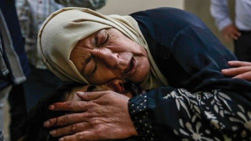 The mother of Palestinian Mohammad Draghmeh mourns over his bofy after he was killed during a raid ... The mother of Palestinian Mohammad Draghmeh mourns over his bofy after he was killed during a raid ...