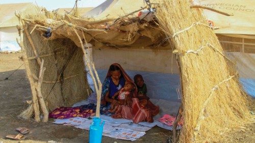 (FILES) A picture taken on March 20, 2024, shows a displaced woman and her children sitting in the ... (FILES) A picture taken on March 20, 2024, shows a displaced woman and her children sitting in the ...