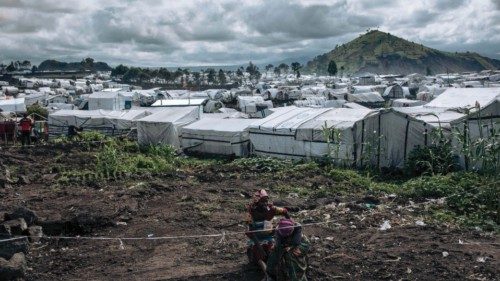 Women sit in the Bulengo camp for war-displaced people, near a front line on the western outskirts ...