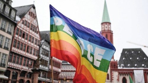 A rainbow colored flag with the inscription 'Peace' flutters in the wind during a demonstration ... A rainbow colored flag with the inscription 'Peace' flutters in the wind during a demonstration ...