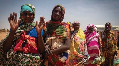 epa11275410 Refugee women from West Darfur wait to get a pack of food for four days from workers of ... epa11275410 Refugee women from West Darfur wait to get a pack of food for four days from workers of ...