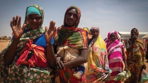 epa11275410 Refugee women from West Darfur wait to get a pack of food for four days from workers of ...