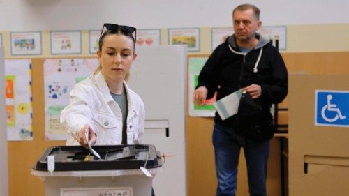 epa11297585 A woman casts her ballot during the first round of the presidential elections, at a ... epa11297585 A woman casts her ballot during the first round of the presidential elections, at a ...