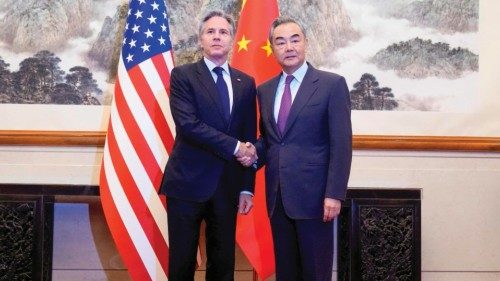 US Secretary of State Antony Blinken (L) shakes hands with China's Foreign Minister Wang Yi (R) ...