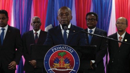 Haiti's new interim Prime Minister Michel Patrick Boisvert addresses the audience after a ...