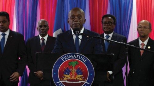 Haiti's new interim Prime Minister Michel Patrick Boisvert addresses the audience after a ... Haiti's new interim Prime Minister Michel Patrick Boisvert addresses the audience after a ...