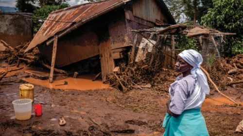 A woman stands assessing the damage in front of her destroyed house in an area heavily affected by ... A woman stands assessing the damage in front of her destroyed house in an area heavily affected by ...