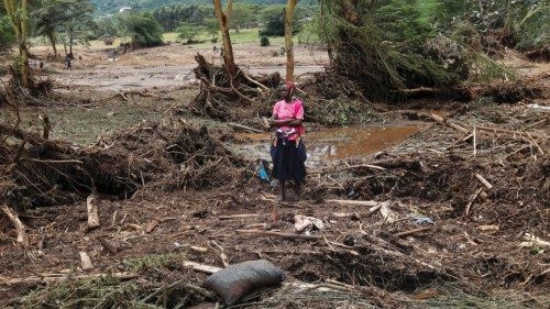 A woman watches as members of the Kenya Defence Forces (KDF) search for the bodies of missing people ... A woman watches as members of the Kenya Defence Forces (KDF) search for the bodies of missing people ...