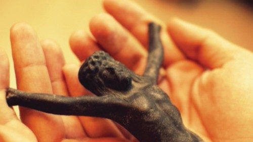 The sculpture of Jesus detached from the cross rests in two hands. It is a symbol of God's love for ... The sculpture of Jesus detached from the cross rests in two hands. It is a symbol of God's love for ...