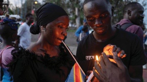 epa11322601 Mourners take part in a vigil to commemorate last week?s attack on displaced people ...