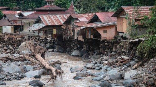 TOPSHOT - Damaged houses are seen after flash floods and cold lava flow from a volcano in Tanah ...