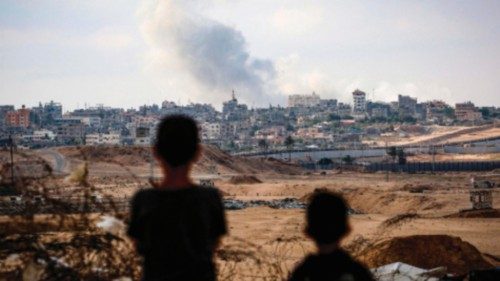 TOPSHOT - Boys watch smoke billowing during Israeli strikes east of Rafah in the southern Gaza Strip ... TOPSHOT - Boys watch smoke billowing during Israeli strikes east of Rafah in the southern Gaza Strip ...