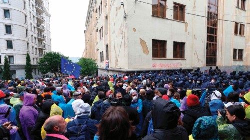Georgian law enforcement officers secure the parliament building as demonstrators protesting the ...