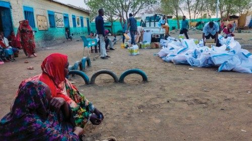 Internally displaced women wait to collect aid from a group at a camp in Gadaref on May 12, 2024. ... Internally displaced women wait to collect aid from a group at a camp in Gadaref on May 12, 2024. ...