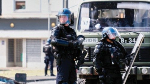 French gendarme officers guard the entrance of the Vallee-du-Tir district, in Noumea on May 14, ... French gendarme officers guard the entrance of the Vallee-du-Tir district, in Noumea on May 14, ...
