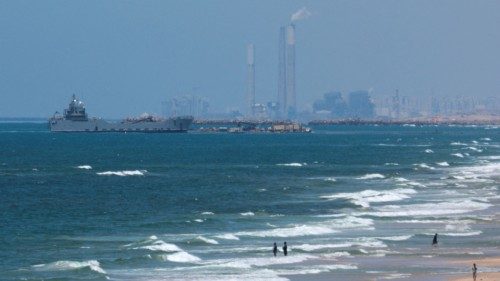 A ship is pictured off the coast of Gaza near a temporary floating pier anchored by the United ... A ship is pictured off the coast of Gaza near a temporary floating pier anchored by the United ...