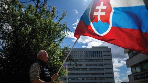 epaselect epa11344104 A man waves the Slovak national flag outside the F. D. Roosevelt University ... epaselect epa11344104 A man waves the Slovak national flag outside the F. D. Roosevelt University ...