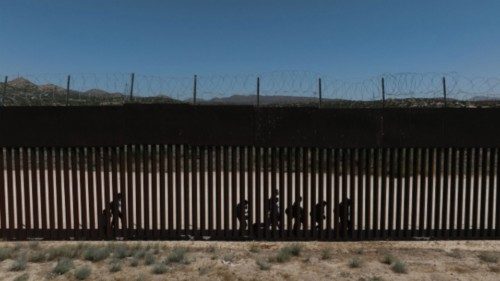 A drone view shows asylum-seeking migrants from Colombia, Peru and Panama as they walk along the ...