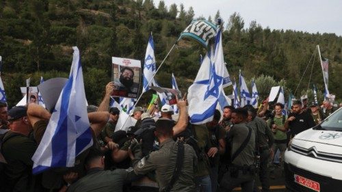 Israeli security forces personnel scuffle with protesters attempting to block a road on a Day of ... Israeli security forces personnel scuffle with protesters attempting to block a road on a Day of ...