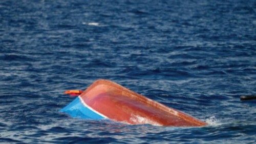 A overturned wooden boat used by migrants sinks after a rescue operation by Spanish NGO Open Arms ... A overturned wooden boat used by migrants sinks after a rescue operation by Spanish NGO Open Arms ...
