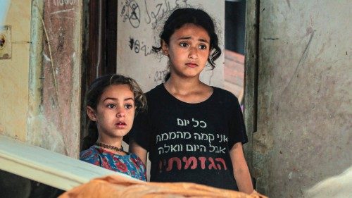 Palestinian children react as they check the damages in Nuseirat following Israeli bombardment ... Palestinian children react as they check the damages in Nuseirat following Israeli bombardment ...
