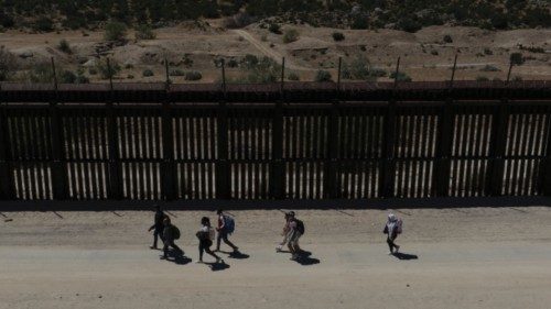 A drone view shows asylum-seeking migrants from Colombia, Peru and Panama as they walk along the ... A drone view shows asylum-seeking migrants from Colombia, Peru and Panama as they walk along the ...