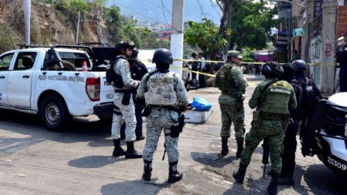 Security forces guard a crime scene where unknown assailants left the dismembered bodies of Anibal ... Security forces guard a crime scene where unknown assailants left the dismembered bodies of Anibal ...