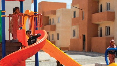 Children play on a playground during the inauguration of newly constructed homes for displaced ... Children play on a playground during the inauguration of newly constructed homes for displaced ...