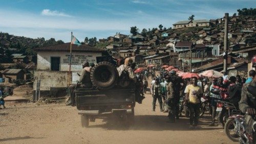 FARDC (Armed Forces of the DRC) soldiers drive through Kanyabayonga, North Kivu province, eastern ... FARDC (Armed Forces of the DRC) soldiers drive through Kanyabayonga, North Kivu province, eastern ...