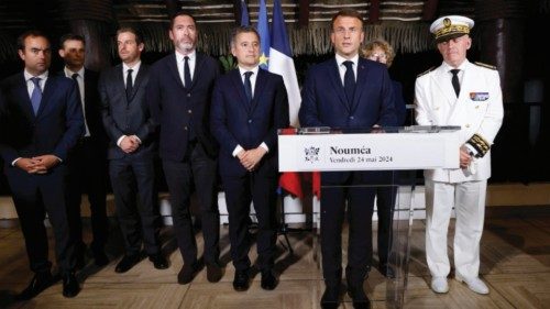 epa11363274 France's President Emmanuel Macron (2-R) delivers a speech next to France's Minister for ...