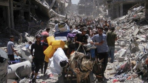 Palestinians make their way, as they inspect the damage after Israeli forces withdrew from Jabalia ... Palestinians make their way, as they inspect the damage after Israeli forces withdrew from Jabalia ...
