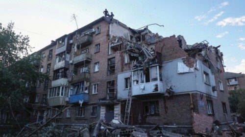 Rescuers work at a site of a residential building hit by a Russian missile strike, amid Russia's ... Rescuers work at a site of a residential building hit by a Russian missile strike, amid Russia's ...