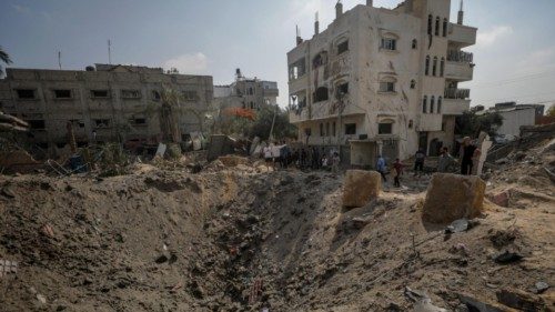 epaselect epa11386861 Palestinians inspect the damage following an Israeli air strike in Al Nuseirat ... epaselect epa11386861 Palestinians inspect the damage following an Israeli air strike in Al Nuseirat ...