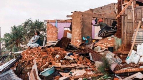 Residents salvage their belongings from destroyed houses in the aftermath of a tornado and extreme ... Residents salvage their belongings from destroyed houses in the aftermath of a tornado and extreme ...