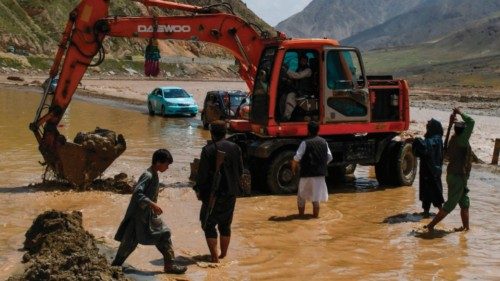 A excavator is employed to clear a highway between Baghlan and Kabul, following flash floods after ... A excavator is employed to clear a highway between Baghlan and Kabul, following flash floods after ...