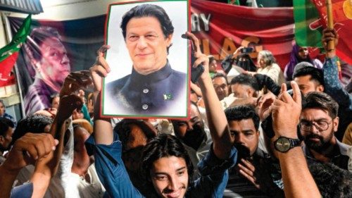 TOPSHOT - Supporters of Pakistan's jailed former Prime Minister Imran Khan hold his poster as they ... TOPSHOT - Supporters of Pakistan's jailed former Prime Minister Imran Khan hold his poster as they ...