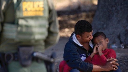epa11390437 A man holds his child as they are processed by US Border Patrol after crossing the US ... epa11390437 A man holds his child as they are processed by US Border Patrol after crossing the US ...