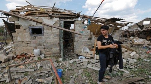 Local resident Marina Isakova, 44, stands near her destroyed house and outbuildings following recent ... Local resident Marina Isakova, 44, stands near her destroyed house and outbuildings following recent ...
