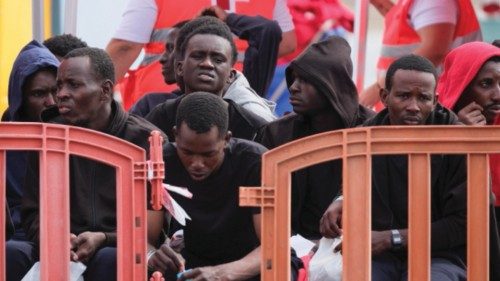 epa11393252 Migrants rest upon arrival to Los Cristianos harbor after they were rescued while trying ... epa11393252 Migrants rest upon arrival to Los Cristianos harbor after they were rescued while trying ...